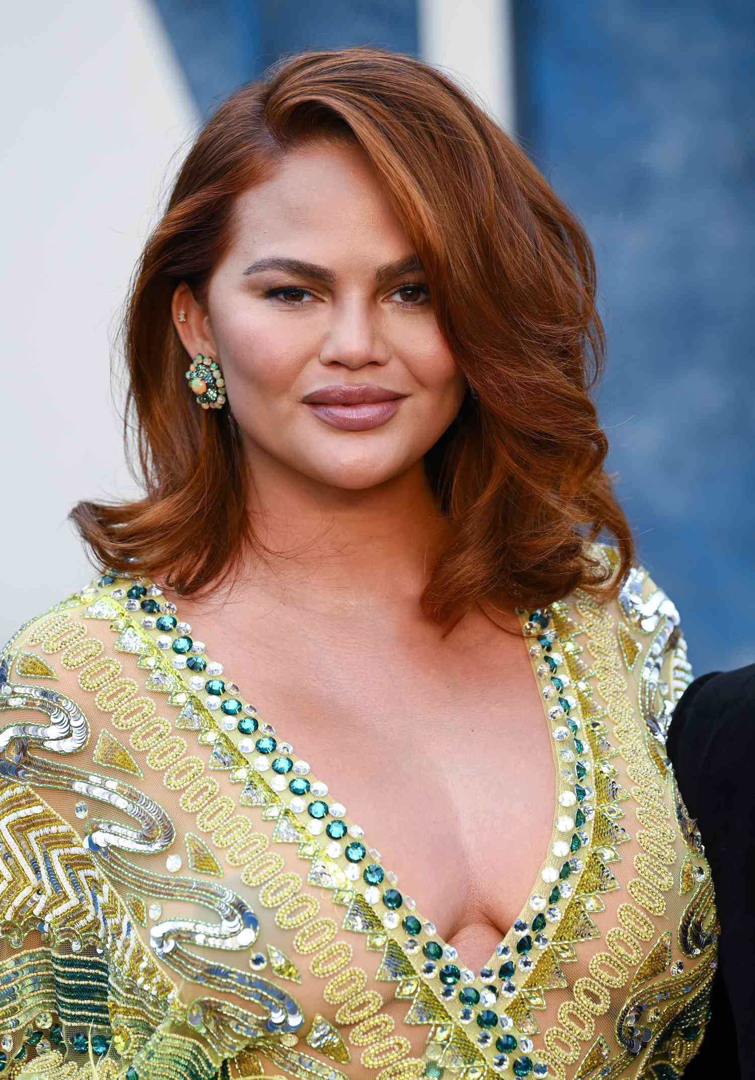 Chrissy Teigen with red-brown hair